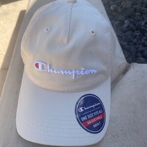 NWT Champion women’s hat color tan. Brand new never worn.